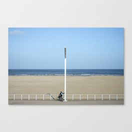 Surfer on the lookout for surf - empty beach - travel and wanderlust - summer - blue sky Canvas Print