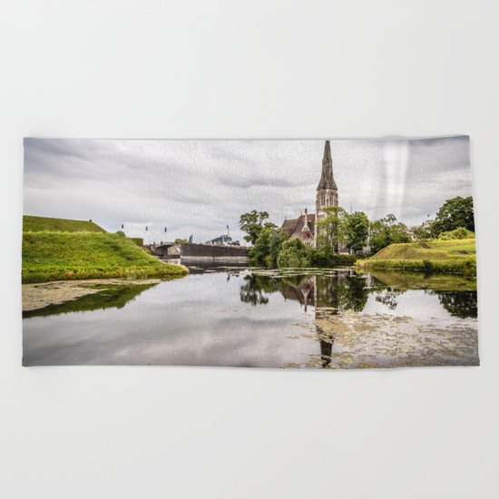 Church in Copenhagen reflections on lake at sunset Beach Towel