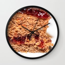 Detail of slice of chocolate cake with strawberry jam filling Wall Clock