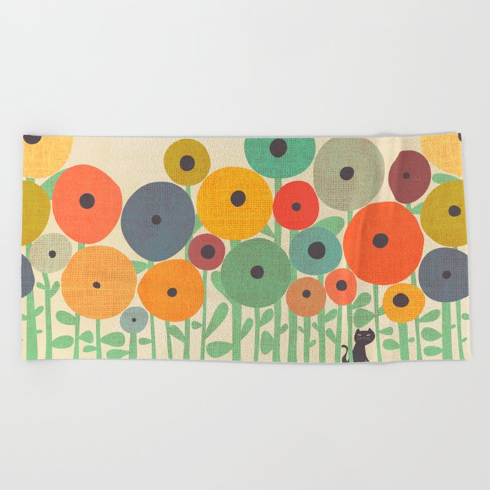 Cat in flower garden Beach Towel