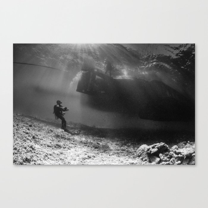 diver looking up, under thew boat Canvas Print
