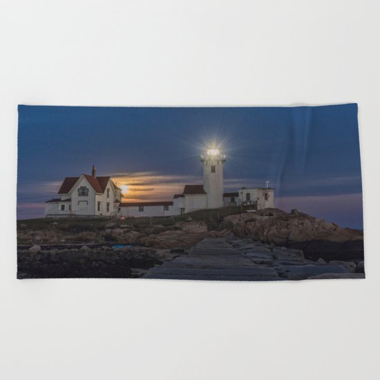 Full moon rising over Eastern point Lighthouse. Beach Towel