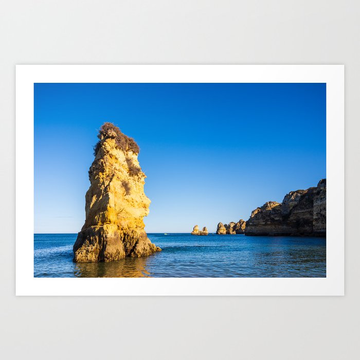 Turquoise waters and cliffs of Praia Dona Ana beach in Algarve, Portugal Art Print