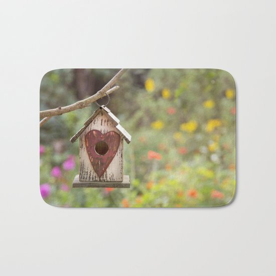 bird house in summer garden Bath Mat