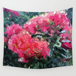 Red flower blossoms amid lush green foliage Wall Tapestry