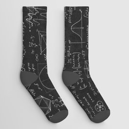 Blackboard inscribed with scientific formulas and calculations in physics and mathematics. Science and education background. Socks