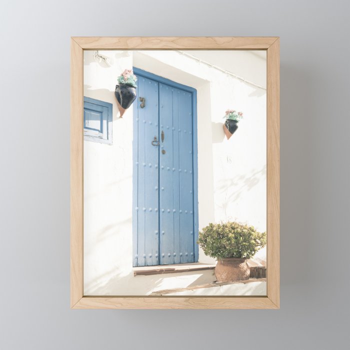 Typical blue door of Spanish Mediterranean white village Framed Mini Art Print