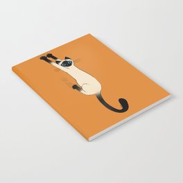 Siamese Cat Hanging On Notebook