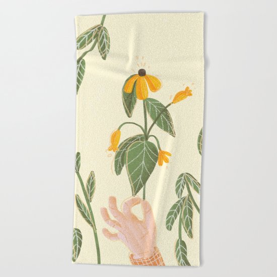 Flower in a hand Beach Towel