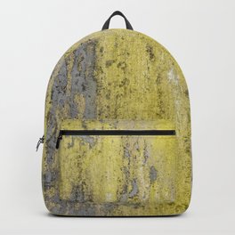 Old gray concrete wall with peeling yellow paint. Texture background.  Backpack