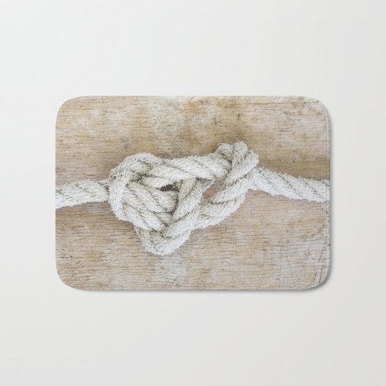 Knot on driftwood Bath Mat