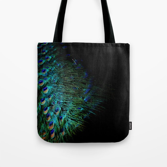 Peacock feathers on a black background Tote Bag