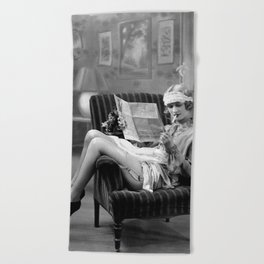 The funny papers; roaring twenties flapper in garter belt and stockings reading newspaper and smoking cigarette portrait black and white vintage photograph - photography - photographs Beach Towel