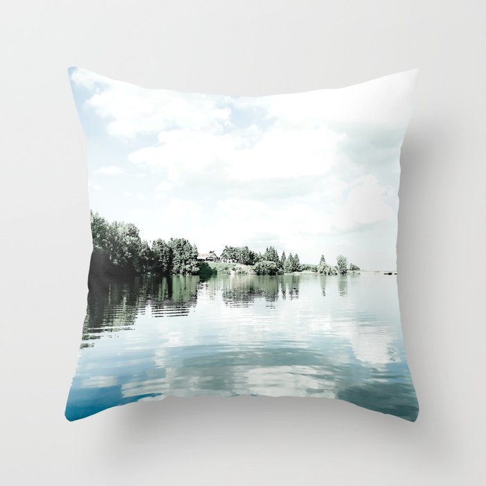 Nature mirror of blue northern lake water on a cloudy day Throw Pillow