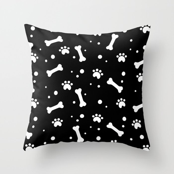 White dog paw and bones pattern on black background Throw Pillow