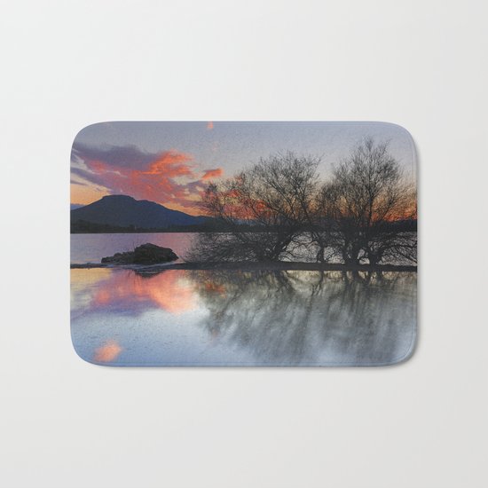 Trees in the water at the red sunset Bath Mat
