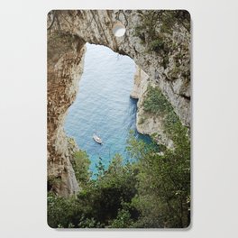 Natural Arch, Capri, Italy | Sailing boat on the sea by the rocky cliffs | Italian Natural Hotspot Cutting Board