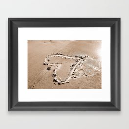 Heart in the sand Framed Art Print