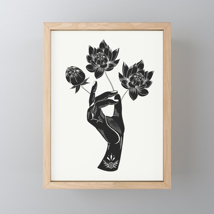 Hand holding lotus flowers  Framed Mini Art Print