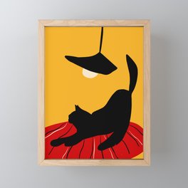 Black cat under a yellow light Framed Mini Art Print