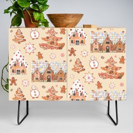 Hand drawn watercolour seamless pattern of gingerbread houses, christmas tree, snowman, snowflakes with the sweets on the beige background.  Credenza