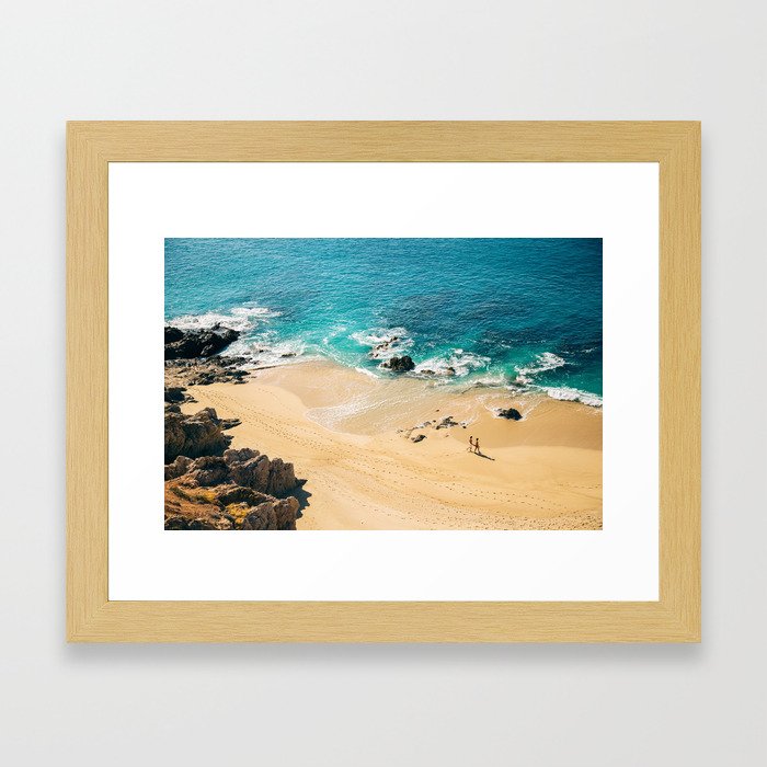 A walk on the beach Framed Art Print