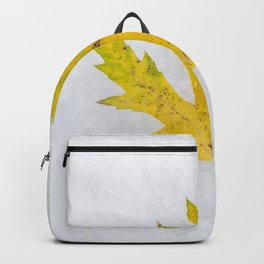 Yellow Maple Leaf on Snow Backpack