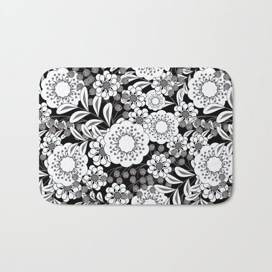 White flowers on a black background. Bath Mat
