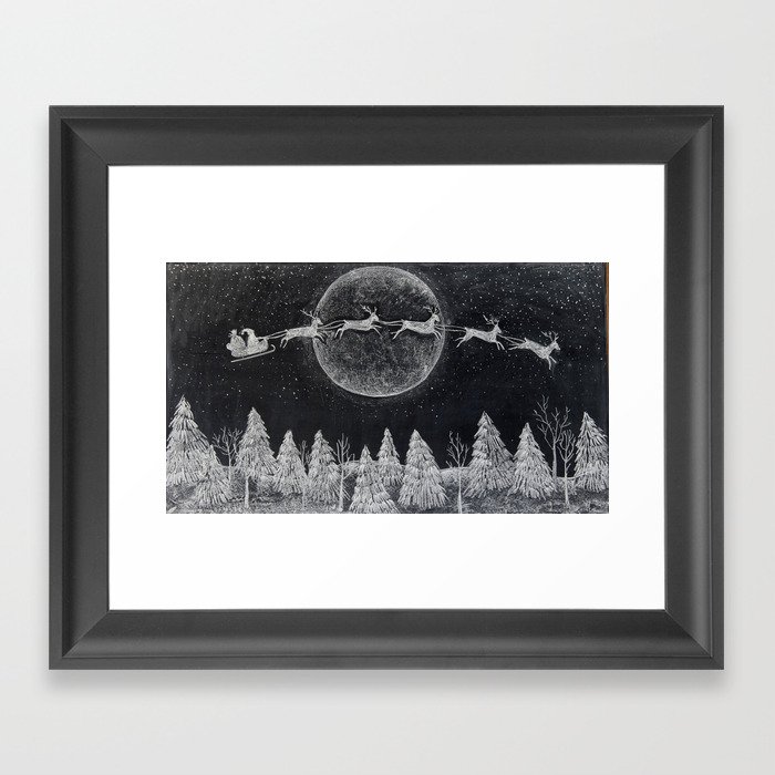 Santa flying over a winter wonderland of snow covered trees in his reindeer drawn sleigh by the light of a full moon Framed Art Print