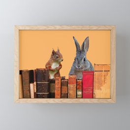 Rabbit with squirrel behind old Books #society6 Framed Mini Art Print