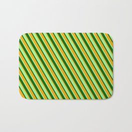[ Thumbnail: Green, Dark Green, and Orange Colored Stripes Pattern Bath Mat ]