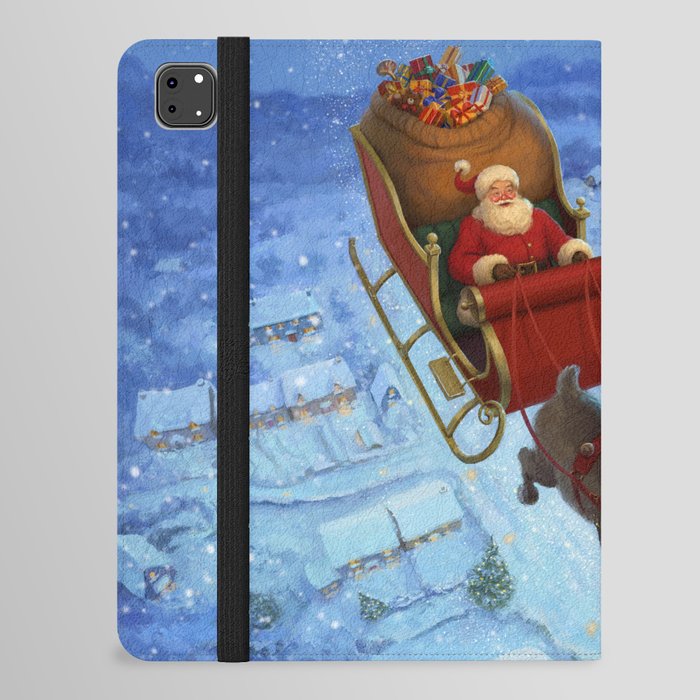 Santa flying over the snowy countryside on Christmas Eve iPad Folio Case
