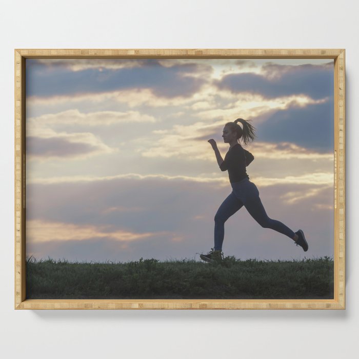 Running woman morning workout. Female Runner. Jogging during sunrise. Workout in a Park. Sporty Serving Tray