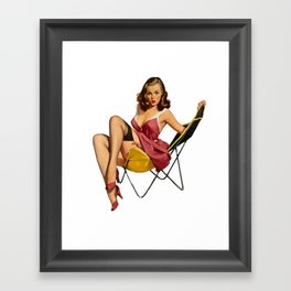 Sexy brunette Vintage Pinup with red dress on a yellow Chair Framed Art Print