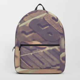 Rows of rusty steel typographic letters Backpack