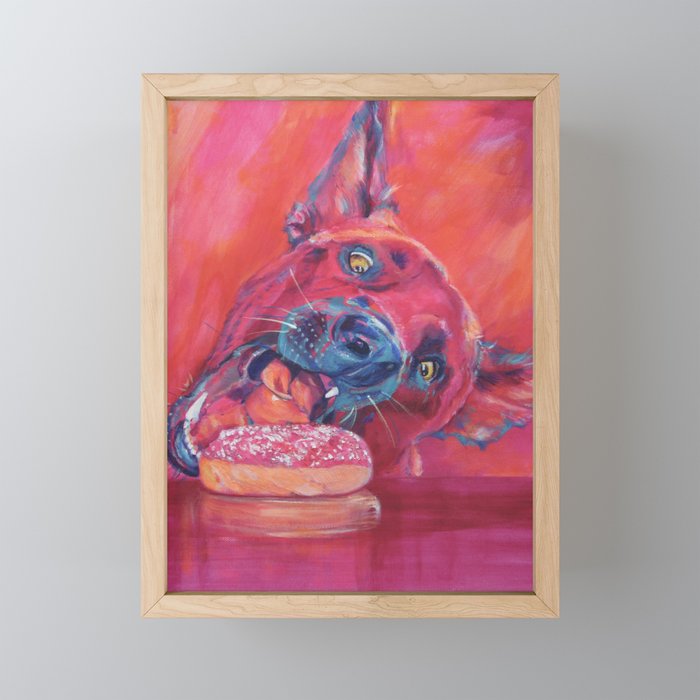 Dog getting closer to donut Framed Mini Art Print