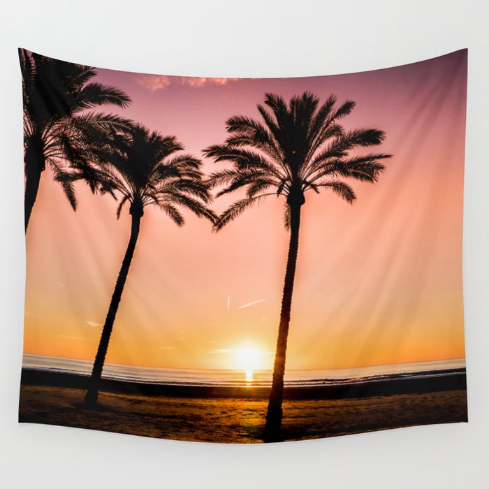 Orange bright sunset at the beach between palms Wall Tapestry