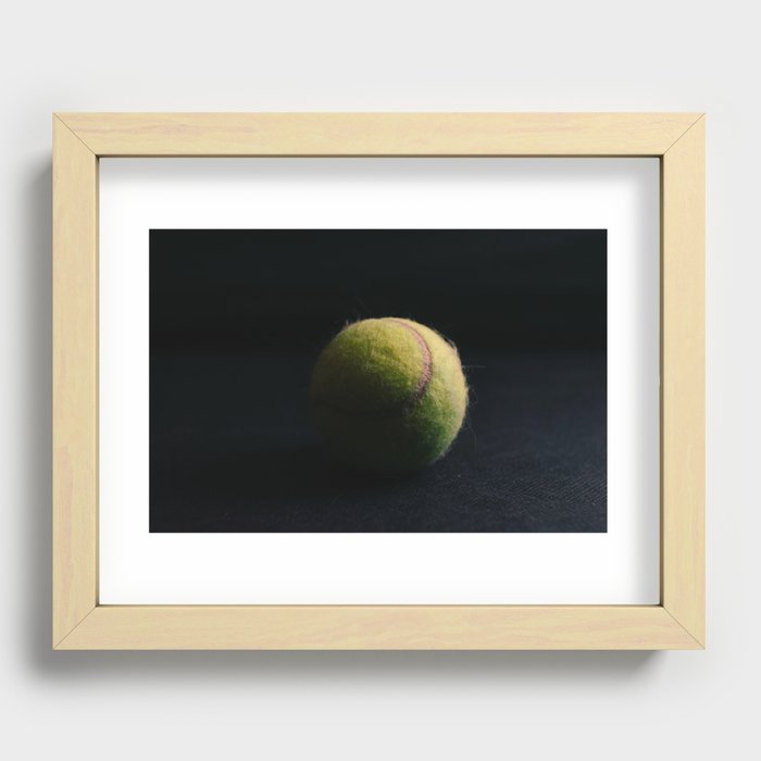 Bright tennis ball on a black background Recessed Framed Print