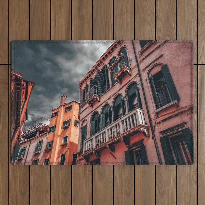 Pink and yellow houses in Venice Italy and a dramatic sky Outdoor Rug