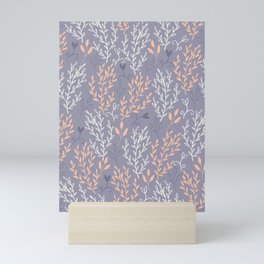 Geneva - orange and white leaves on blue background Mini Art Print