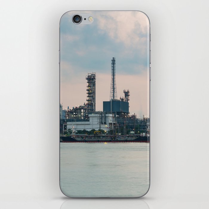 Oil refinery riverfront, vintage tone during sunrise iPhone Skin