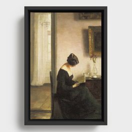 Woman on a Chair Reading Framed Canvas