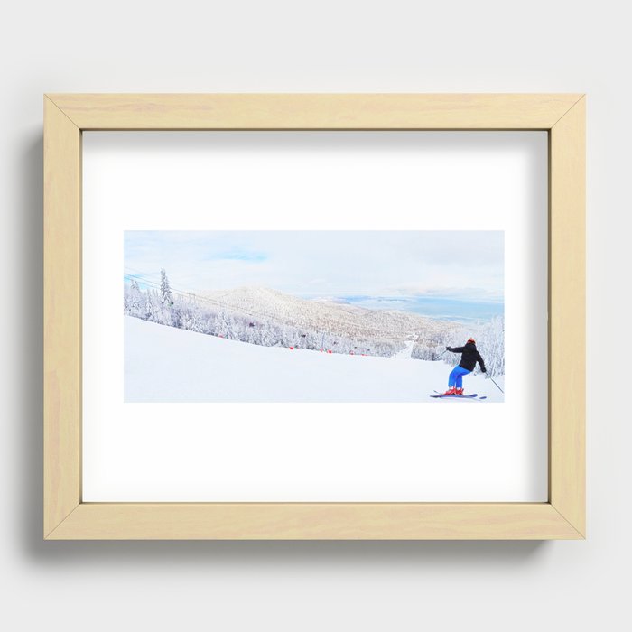Skier at a ski resort with snowy mountain and lake Recessed Framed Print