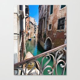 Venice Canal Over the Scroll of an Iron Rail Canvas Print