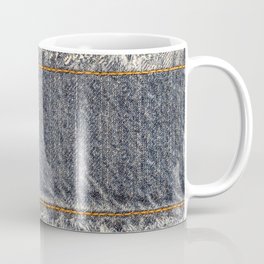 Denim blue jeans fabric frame. Bleached denim fabric with fringe edge and straight stitch with orange thread, on blue denim background, text place, copy space. Worn Jeans Casual Double Color patch Coffee Mug