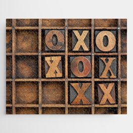 tic-tac-toe or noughts and crosses game - vintage letterpress ing block X and O in wooden grunge typesetter box with dividers Jigsaw Puzzle