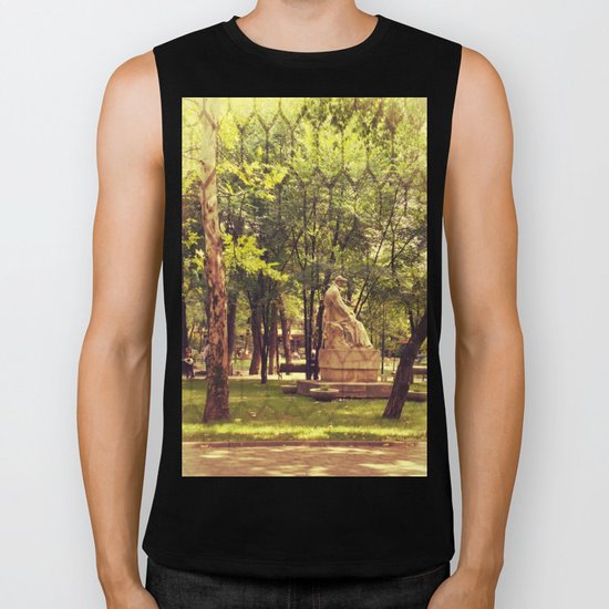 End of summer in park with trees and statue Biker Tank