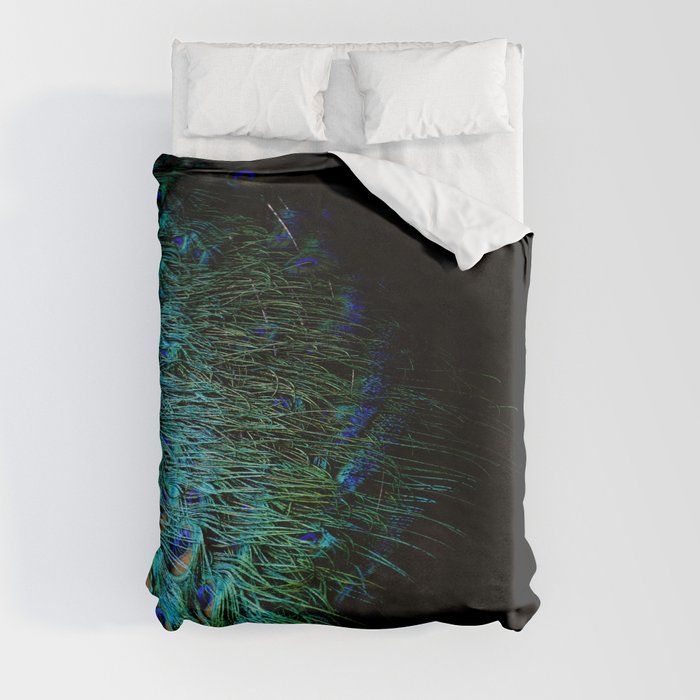 Peacock feathers on a black background Duvet Cover