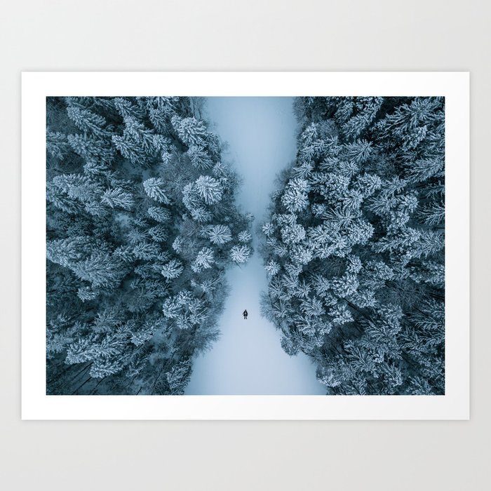Man lying in the snow on a frozen lake in a winter forest - Landscape Photography Art Print