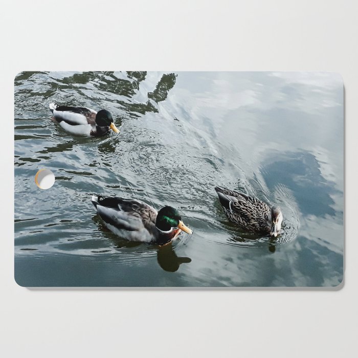 Three ducks swimming Cutting Board